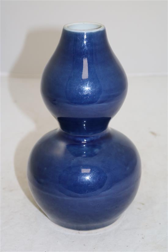 A Chinese blue monochrome double-gourd vase, Wanli six character mark and probably of the period, height 22.5cm